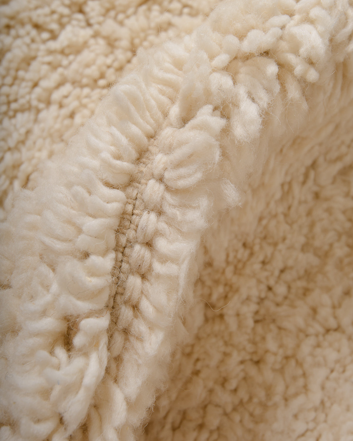 Modern, designer, handcrafted Berber rug from Morocco. Beniourain carpet with minimalist design, natural wool pile and a fluffy texture.